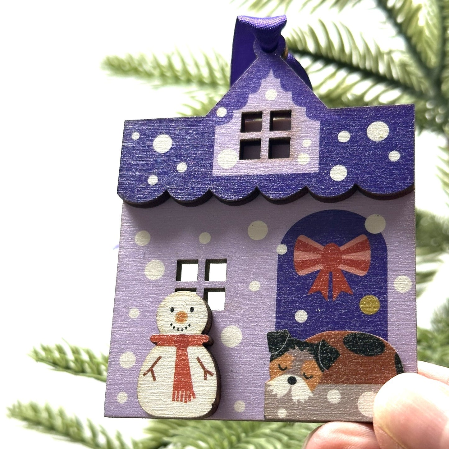 Purple Snowy House Christmas Decoration, with sleepy Terrier Dog