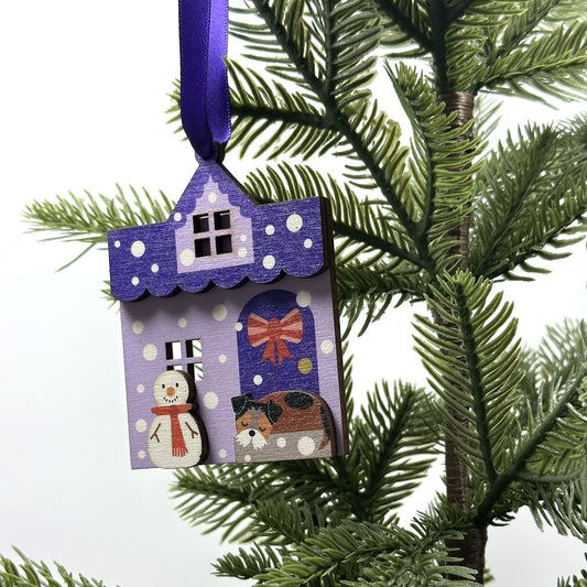 Purple Snowy House Christmas Decoration, with sleepy Terrier Dog