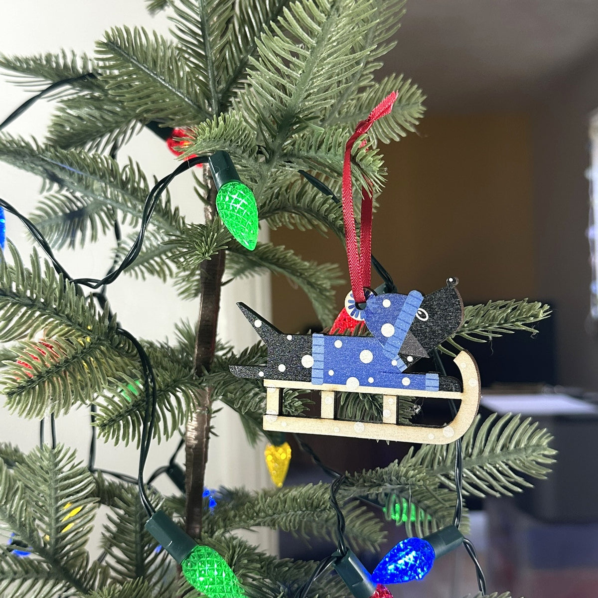 Black Labrador Dog on a Christmas Sledge - Tree Decoration