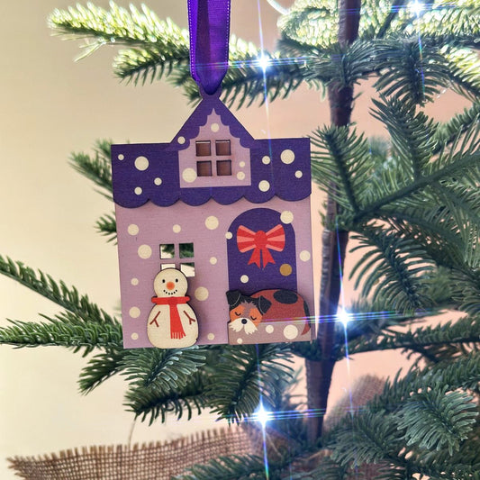 Purple Snowy House Christmas Decoration, with sleepy Terrier Dog